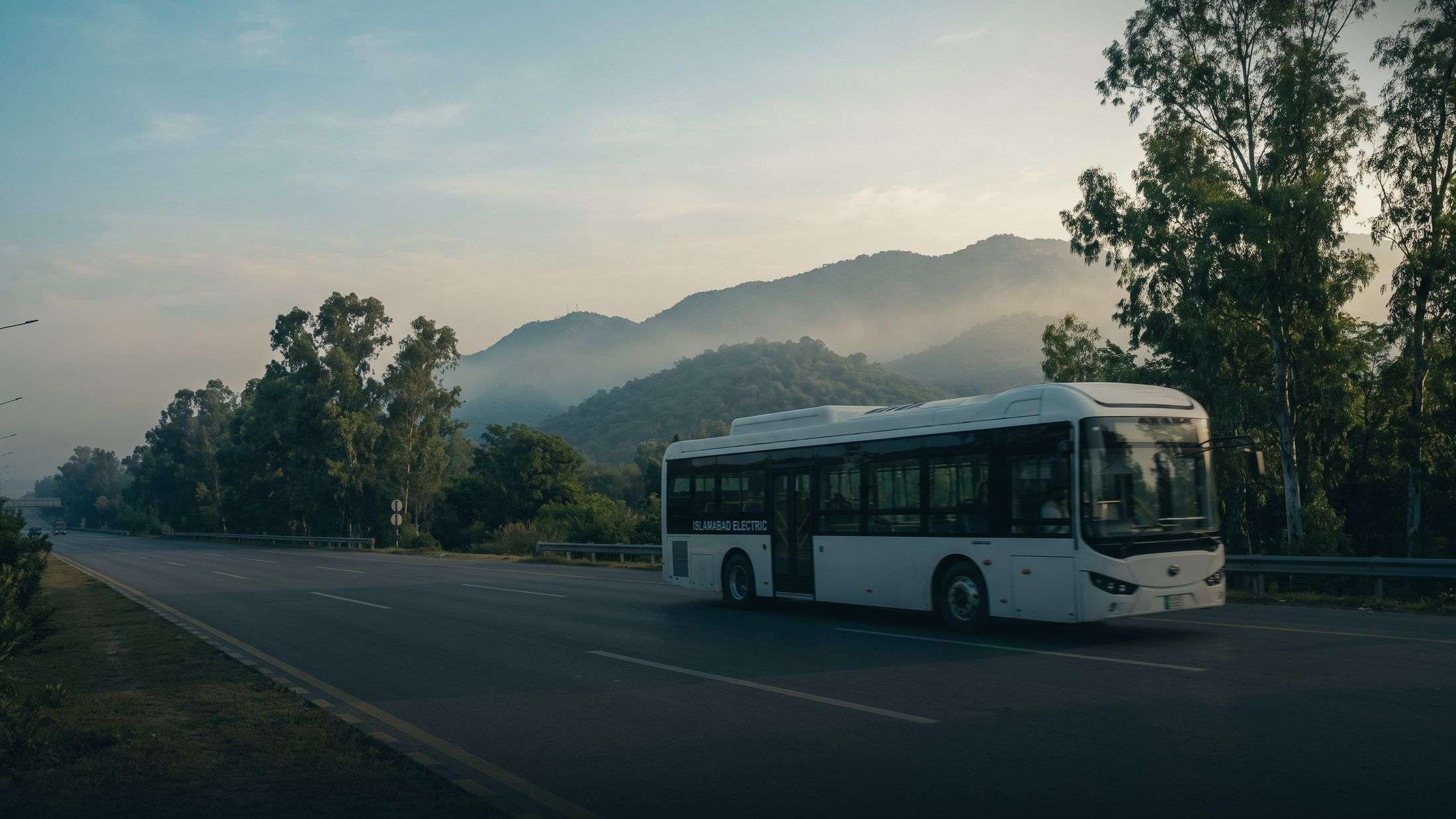 An electric bus in service on an open highway at dawn